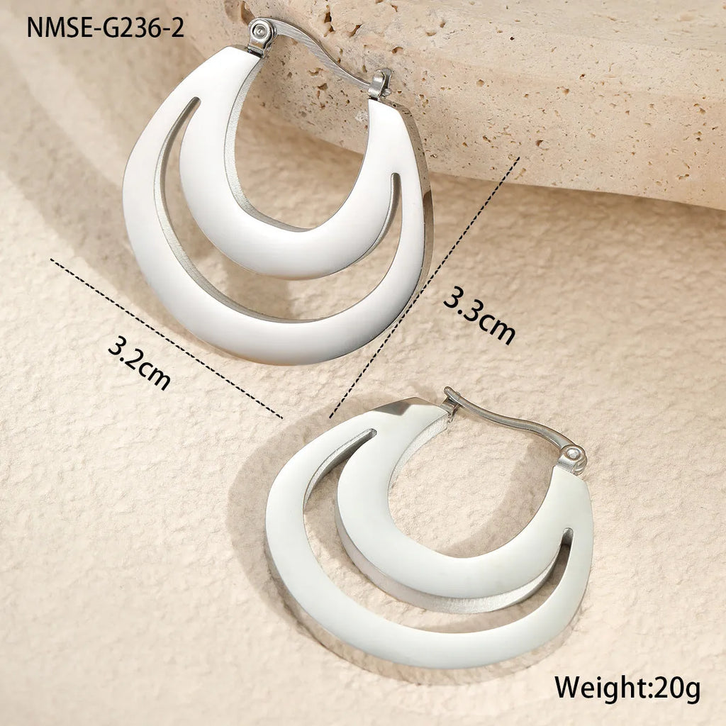 Metallic French geometric earrings with gold plating on stainless steel, featuring round ring elements
