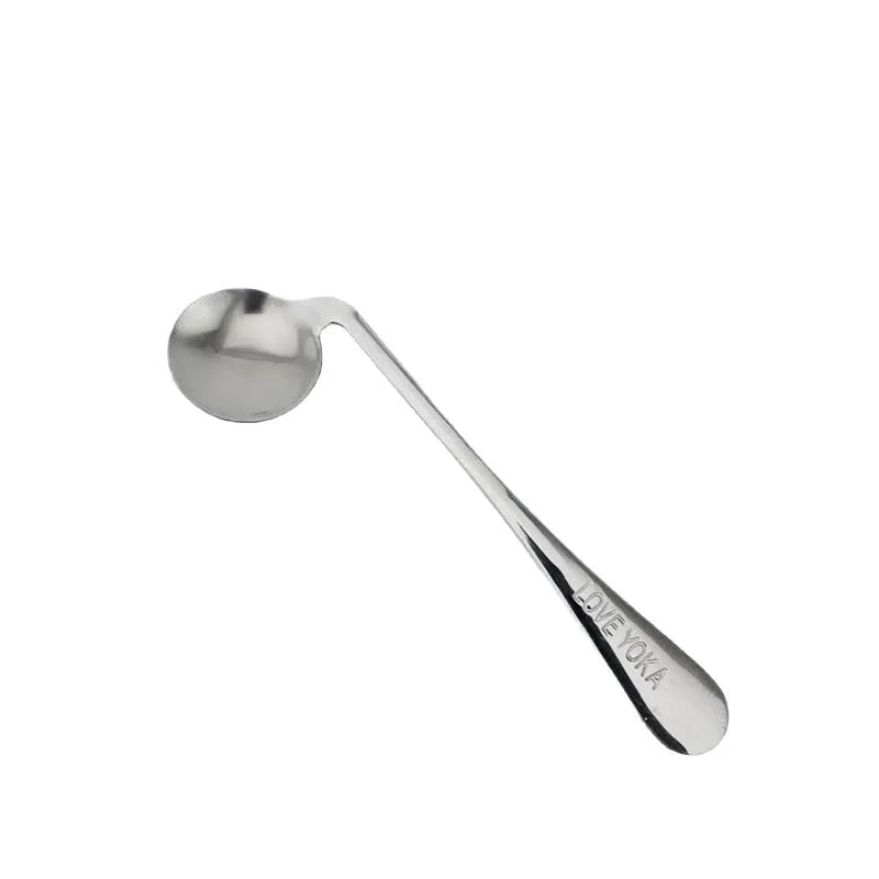 Stainless steel adaptive spoon for elderly feeding care, left hand version on white background