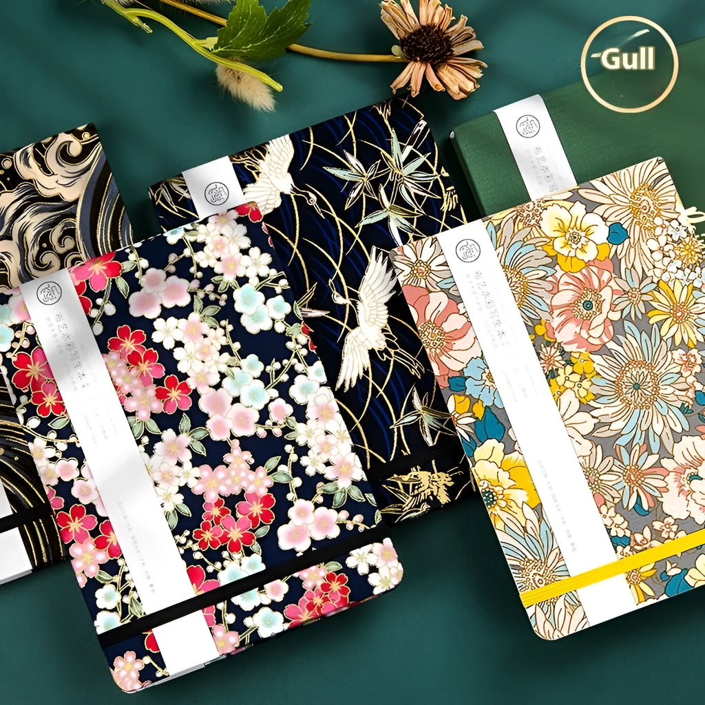 Feiluniao fabric watercolour notebook showing floral and animal cover designs in 185mm length