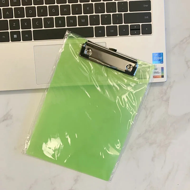 A4 transparent polypropylene clipboard with metal clip, shown in blue, holding paper.