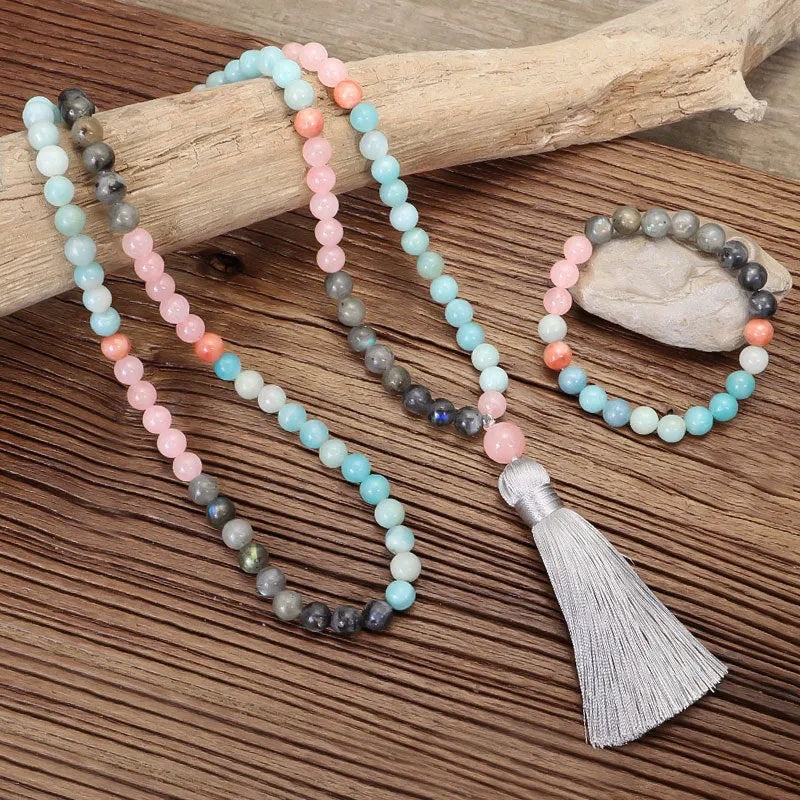 Bohemian 108 colourful stone necklace with drop-shaped tassel pendant on white background