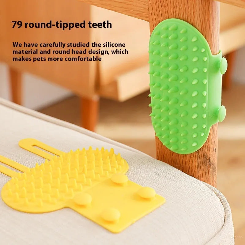 Silicone cat grooming massage comb with adjustable strap mounted on furniture leg