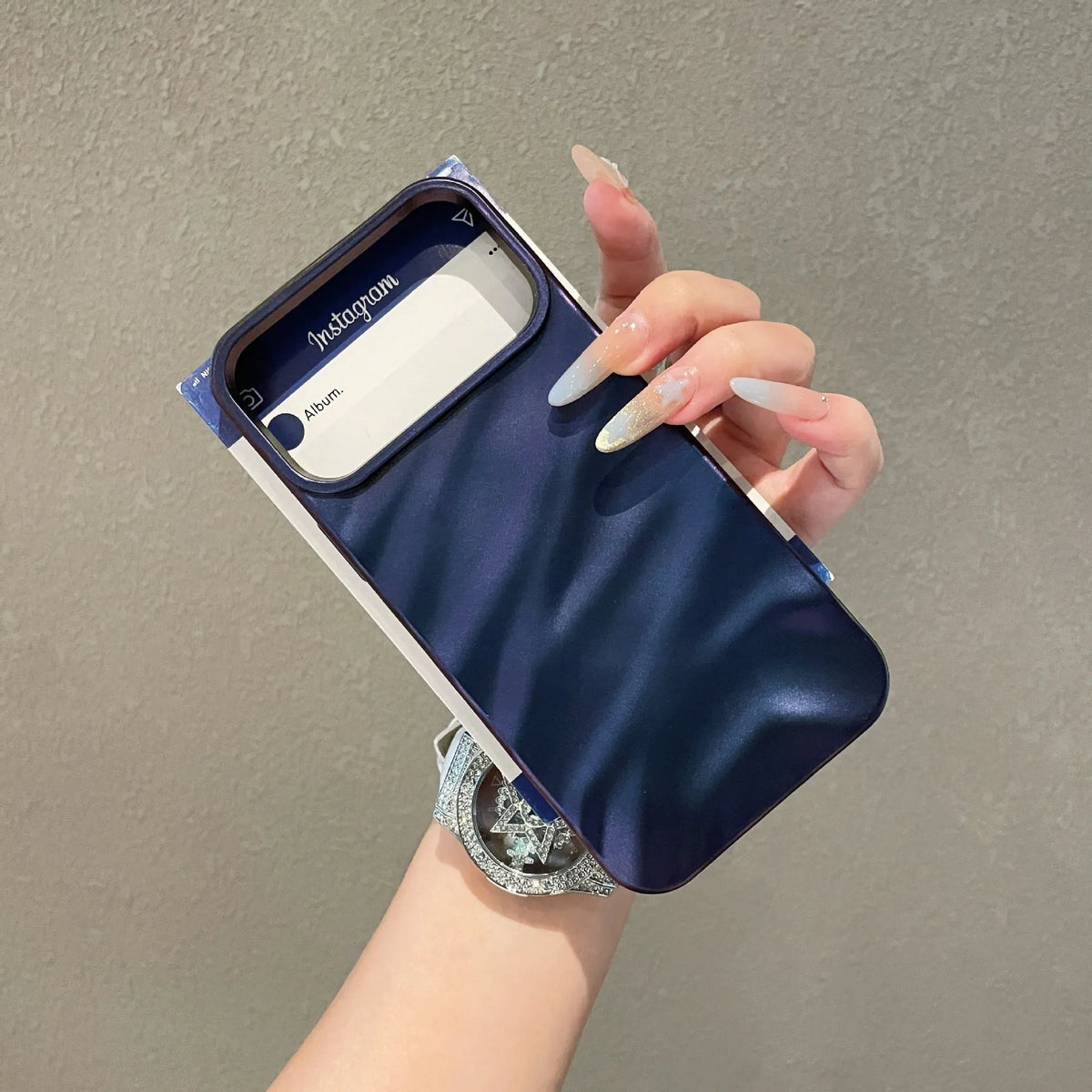 Soft solid colour wave pleated TPU protective case for Apple iPhone 17 series in burgundy on a white background.