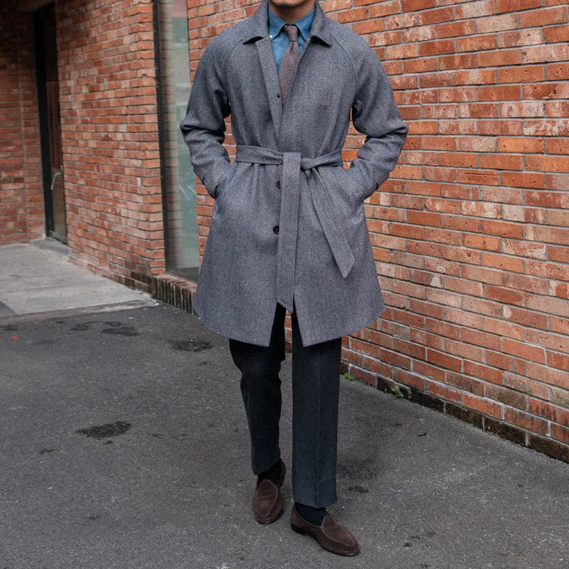 Men's herringbone wool slim fit mid length coat in blue with lapel collar and single-breasted placket