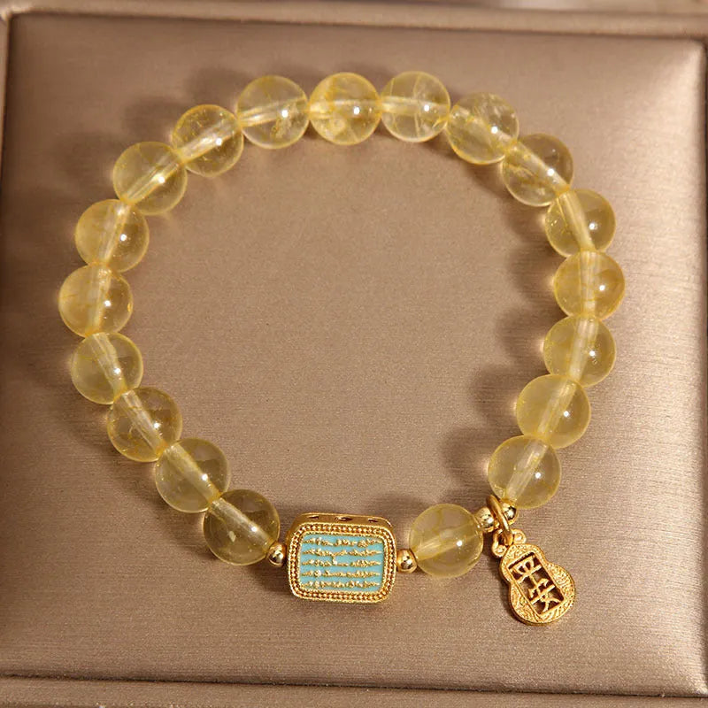 Women's yellow citrine crystal bracelet with rhinestone detailing and adjustable closure
