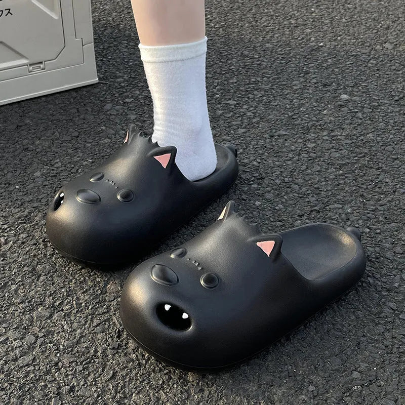 Women's black EVA foam puppy slippers with a toe cap sandal design on a white background.