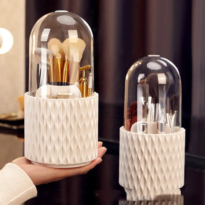 White rotating makeup brush storage box with transparent dust-proof cover on desktop