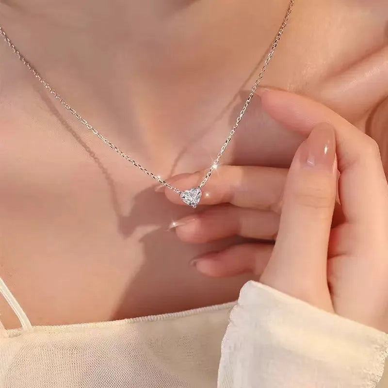 Women's silver love necklace with heart pendant on copper chain