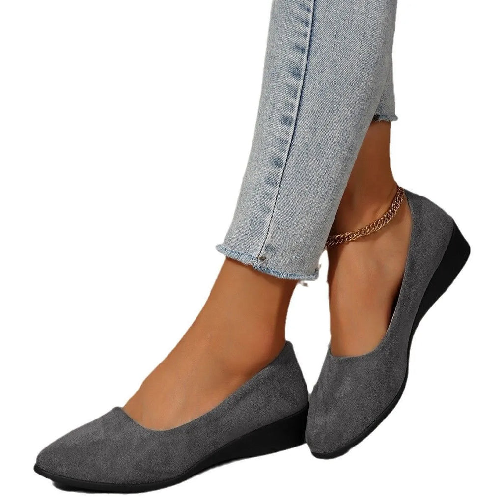 Women's pointed toe suede wedge pumps in light brown with a shallow mouth and low rubber sole.