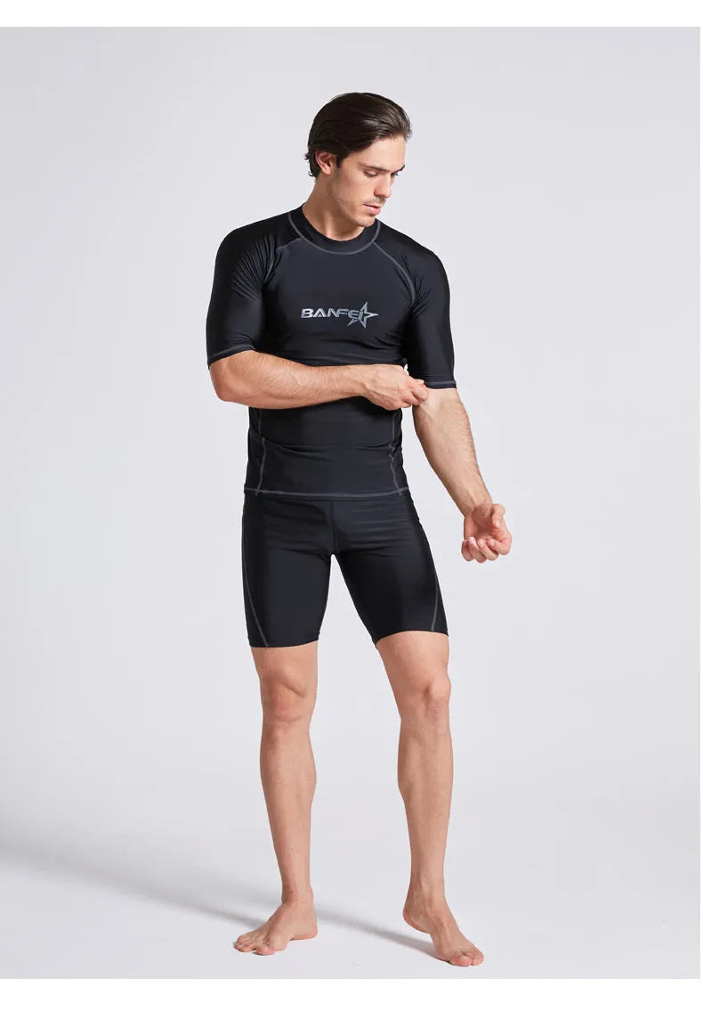 Men's blue half-sleeve quick-dry nylon swimsuit top and pants set for swimming and surfing.