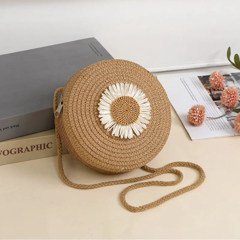 Woven straw raffia crossbody bag in beige colour showing 16cm diameter.