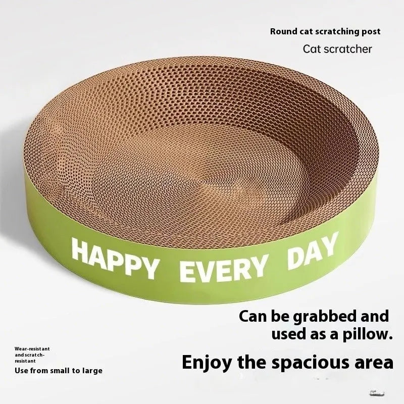 A simple green round woven cat scratching board nest bed on a floor.