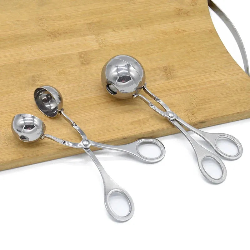 304 stainless steel meatball maker tongs on plain background, shows clip design and two size options, 16.5 cm length