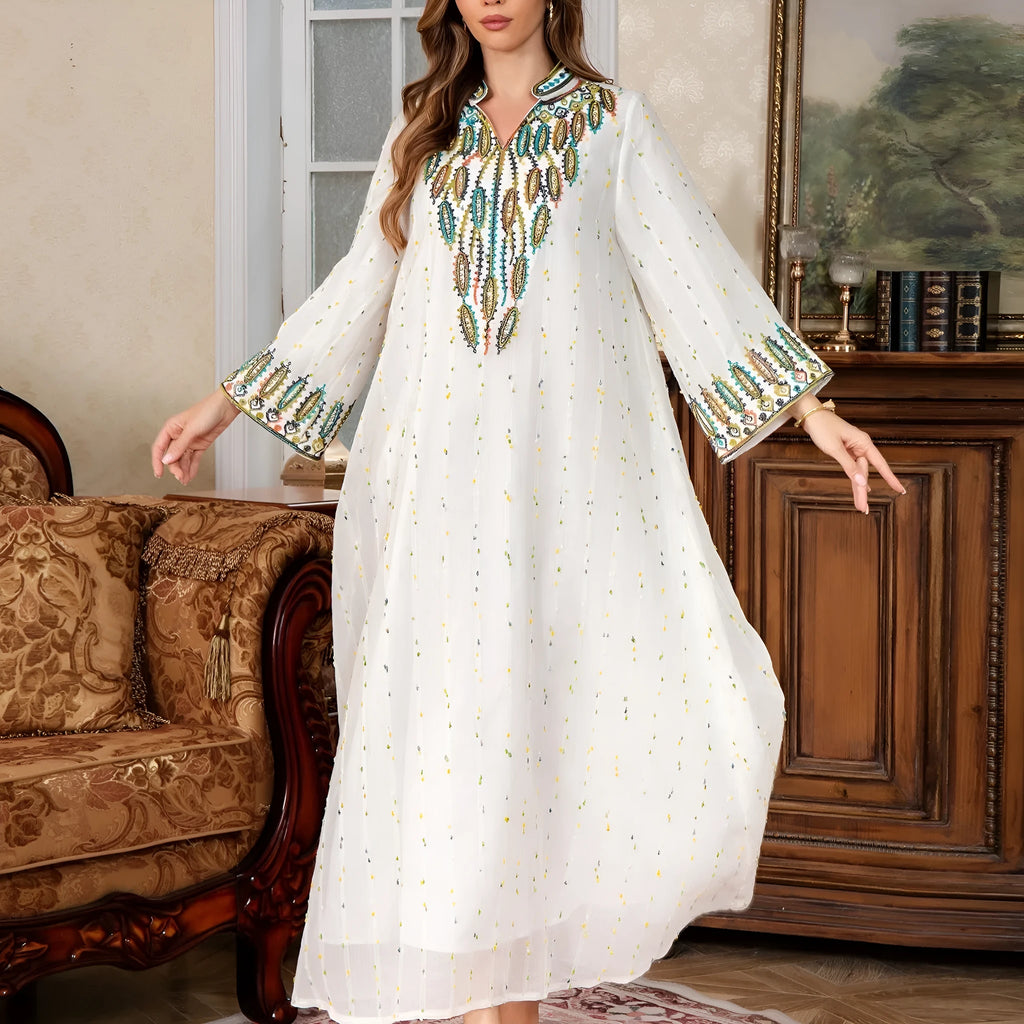 White long sleeve floor-length Arabic robe for women on a hanger