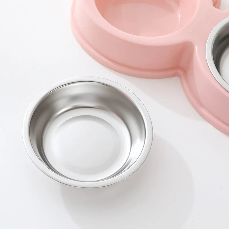 Blue stainless steel double pet bowl with frog design for cat and dog food and water.