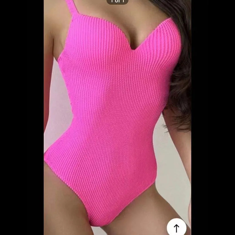 Women's black sleeveless one-piece swimsuit with sunkissed stripe detail on mannequin.