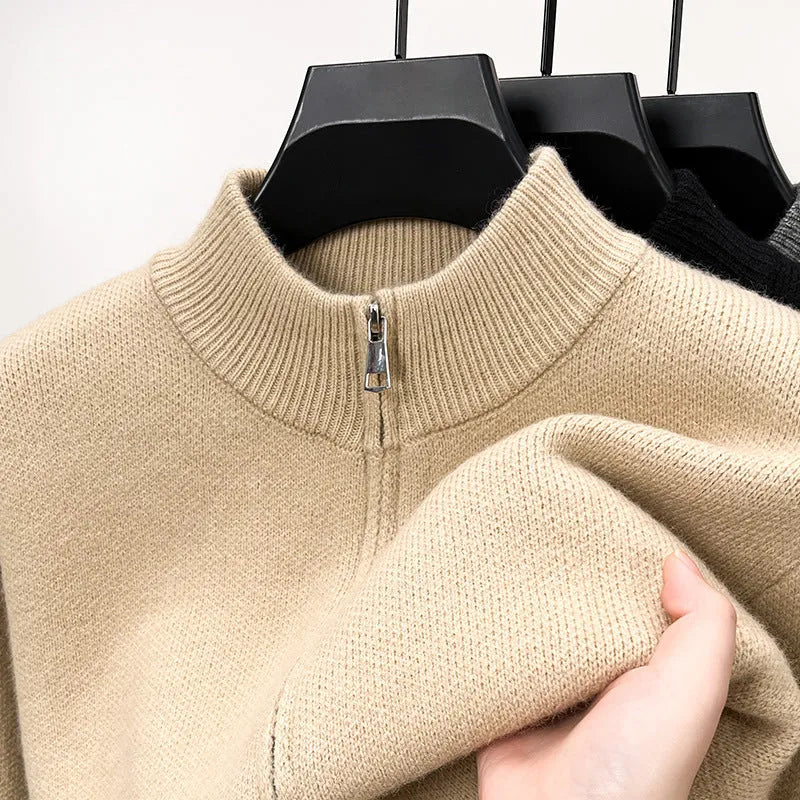 Men's black knitted cardigan with a stand collar and full-length front zipper, shown in a loose fit.