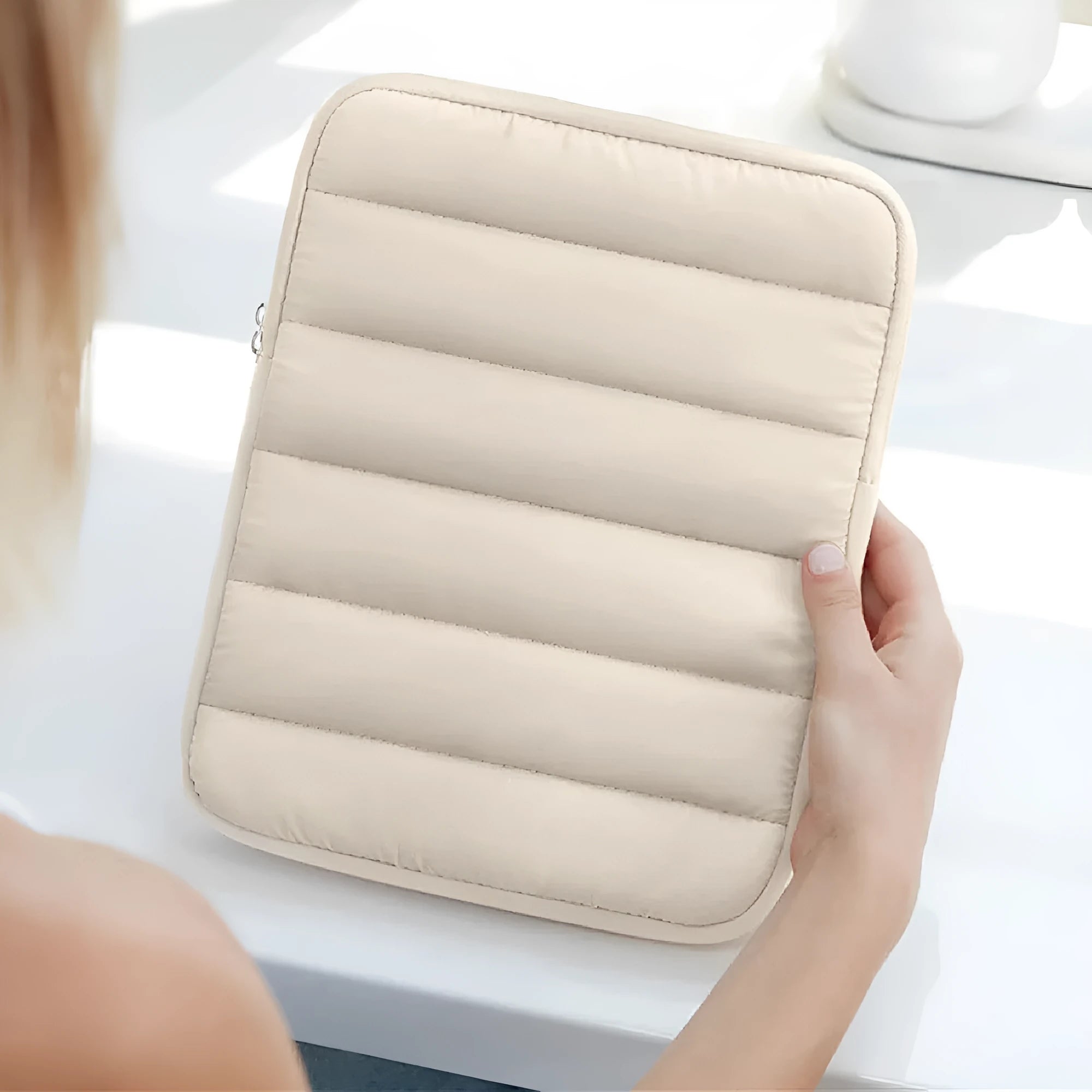 Black fluffy padded laptop sleeve for 9.7 to 11-inch devices with elastic sides.