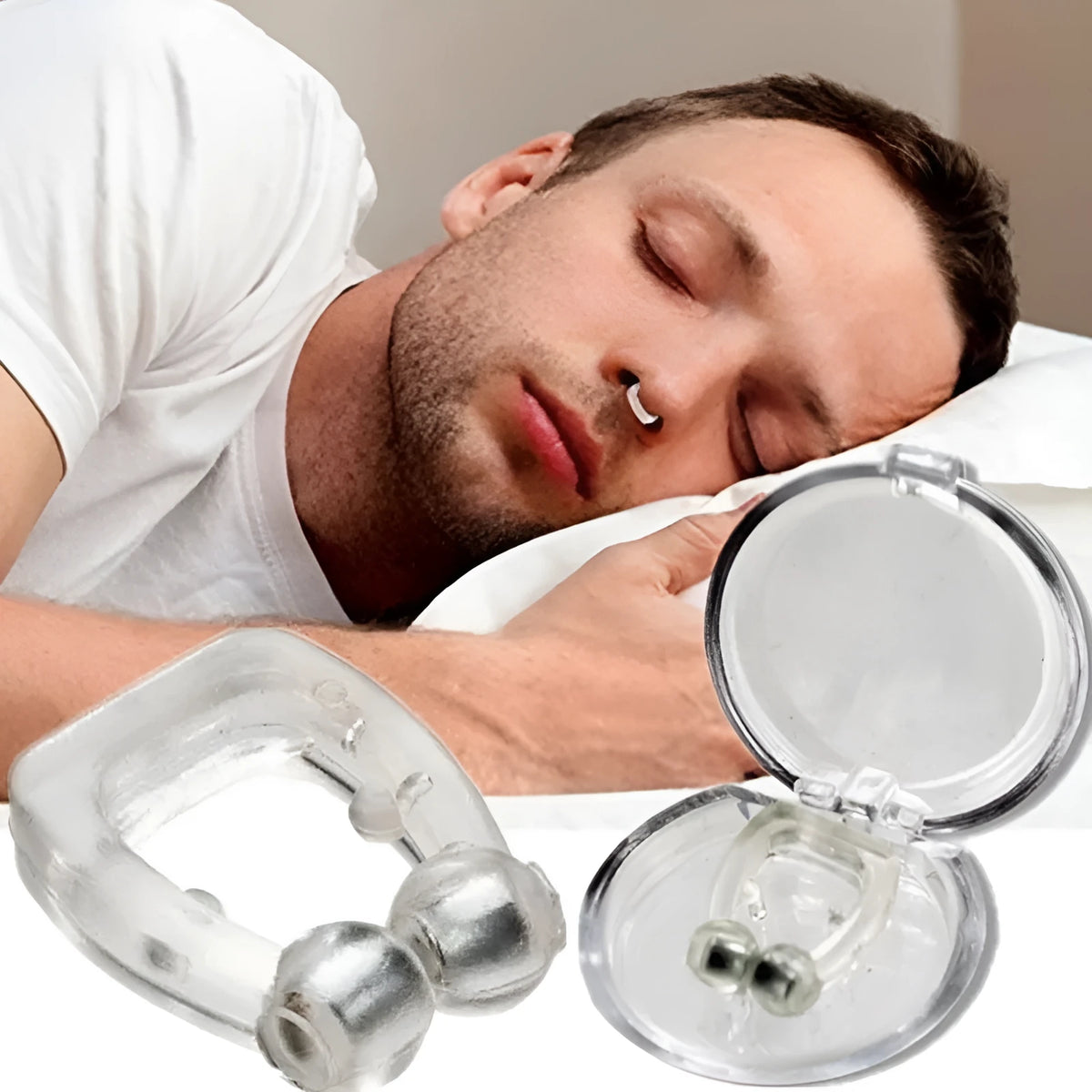 Mini magnetic silicone anti-snoring nose clip in white on a transparent plastic box