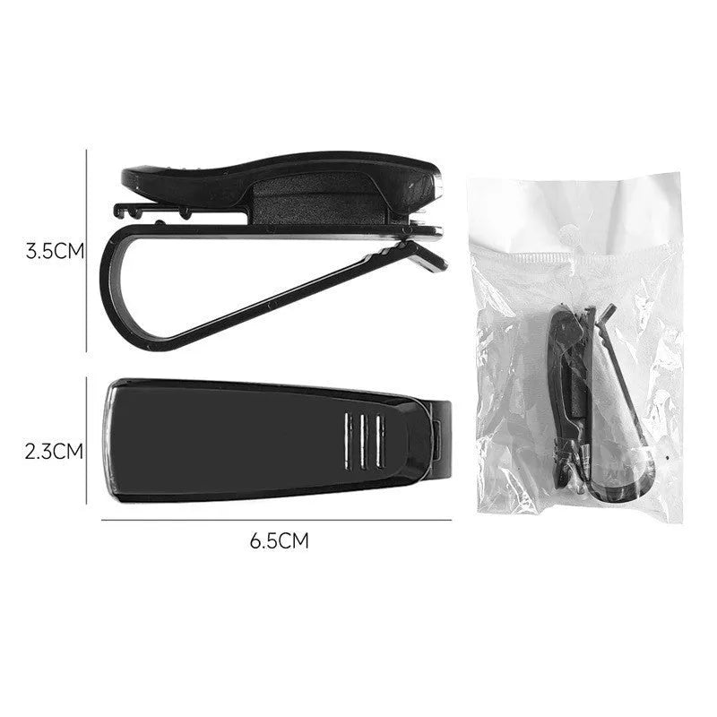 Black plastic clip for car sunshade to hold sunglasses and cards, dimensions 6.5 by 2.3 cm.