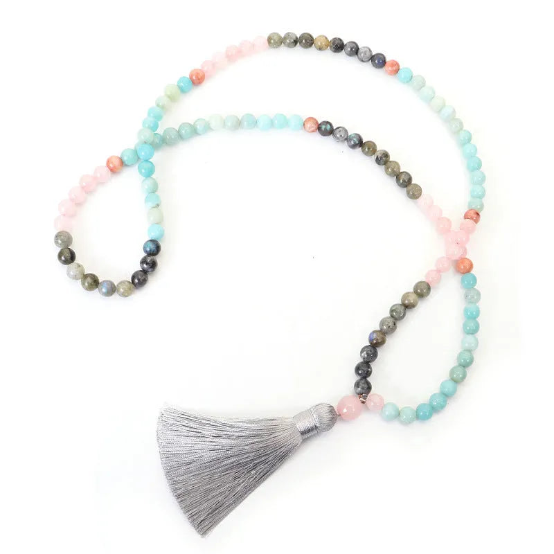 Bohemian 108 colourful stone necklace with drop-shaped tassel pendant on white background