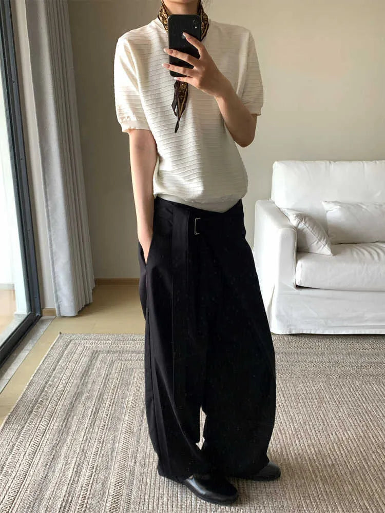 Black straight-leg trousers with adjustable waistband and single pleat detail