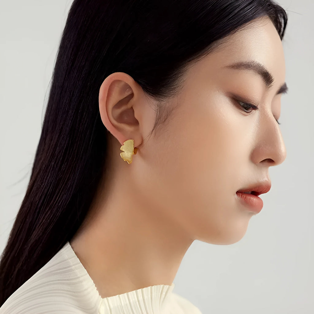 925 sterling silver stud earrings with 14k gold plated ginkgo biloba leaf design in gold colour