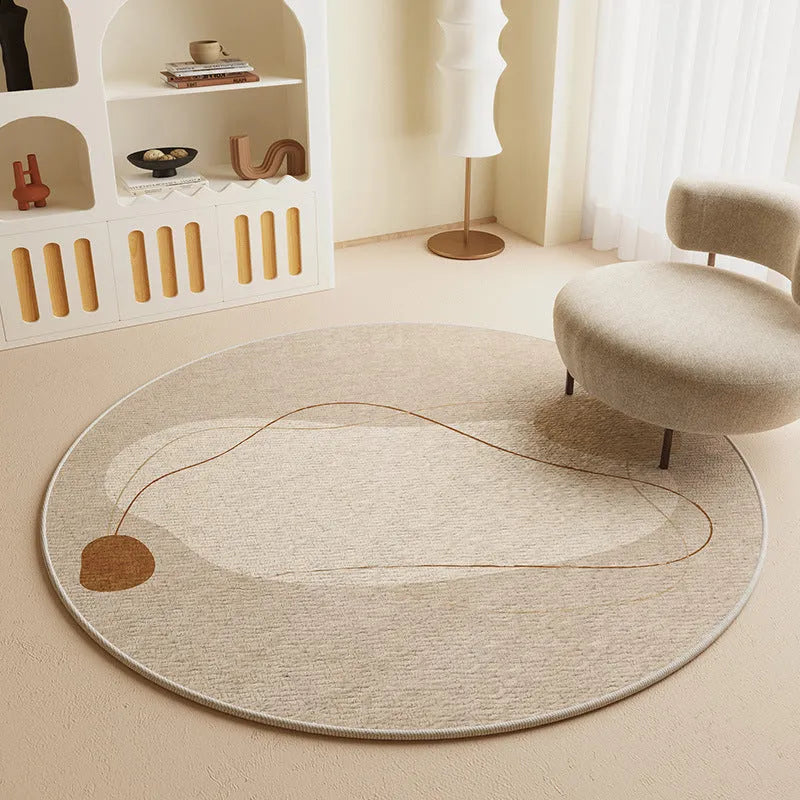 Simple round carpet in modern geometric pattern on floor under desk with swivel chair