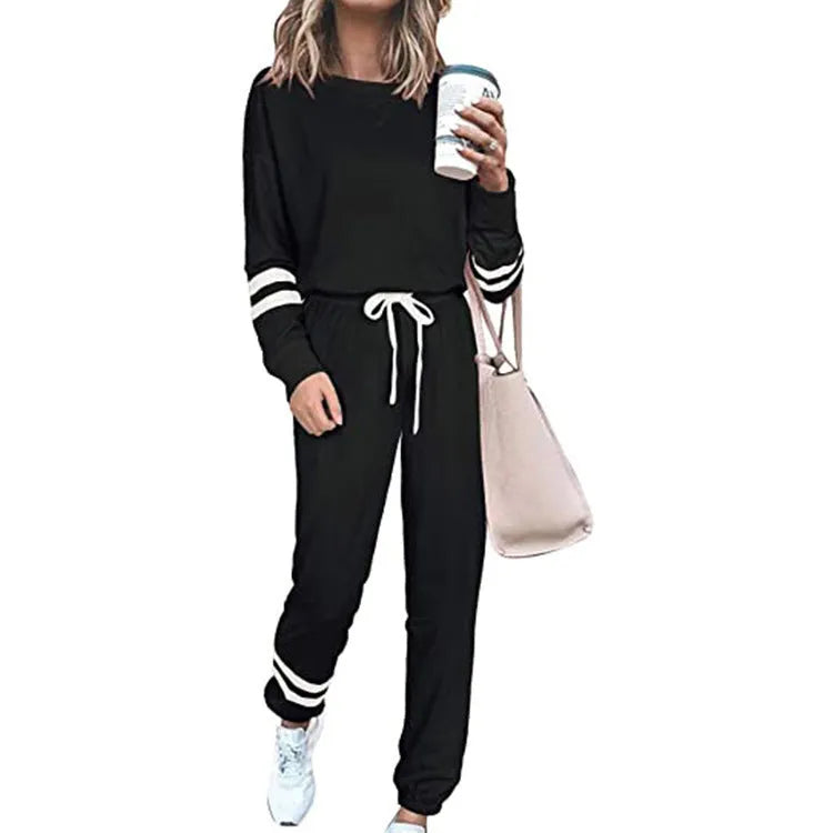 Women's loose-fitting casual suit in solid colour, showing long sleeve top and trousers in cotton blend fabric.