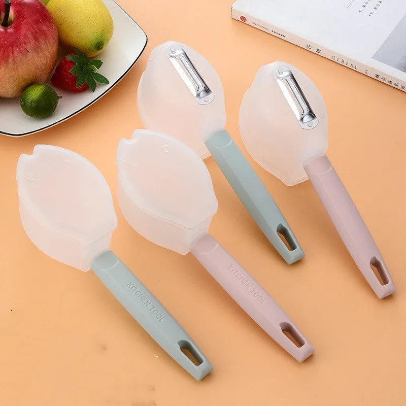 Stainless steel fruit peeler with PP handle, shown in pink or blue, modern minimalist kitchen gadget for fruit peeling