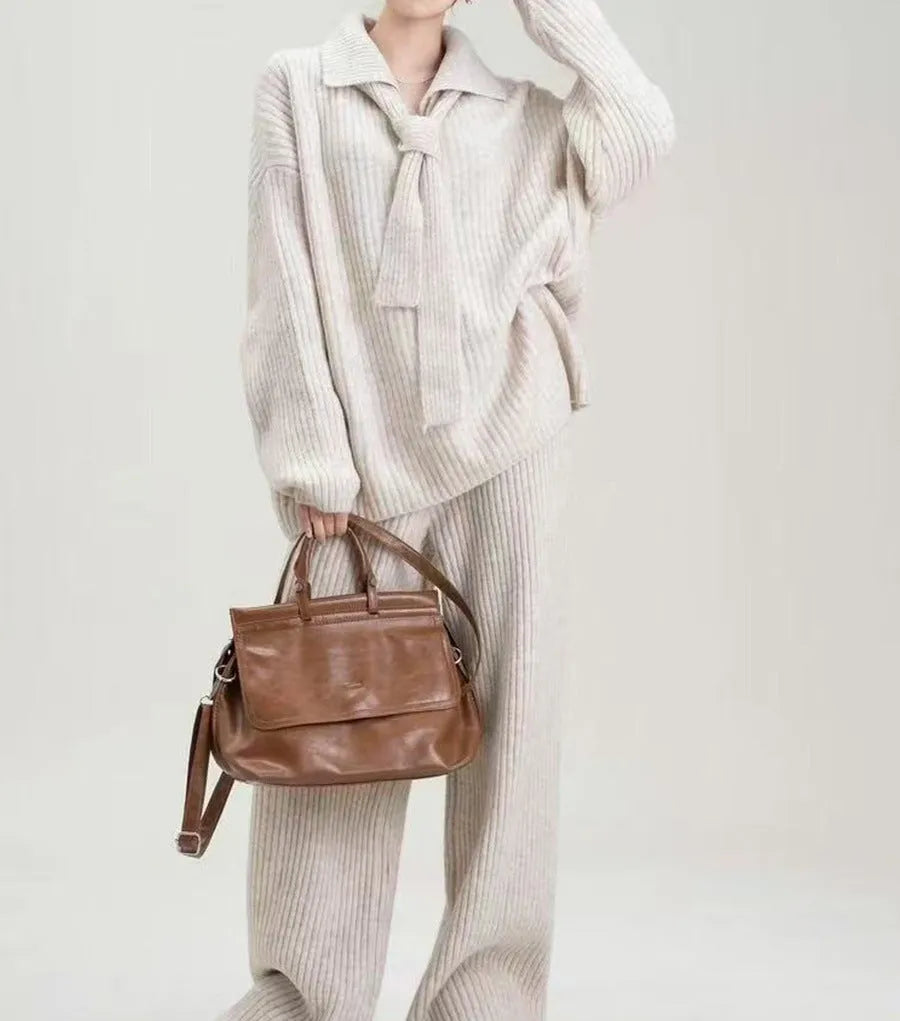 Acrylic knit sweater suit two-piece set showing top and trousers in beige colour