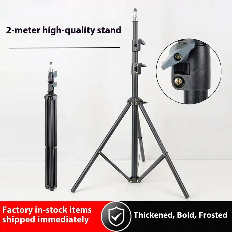 Frosted tripod light stand with mobile phone holder mounted, showing carbon steel construction
