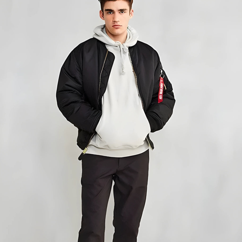 Men's army green loose fit nylon pilot jacket with cotton padding on a hanger.