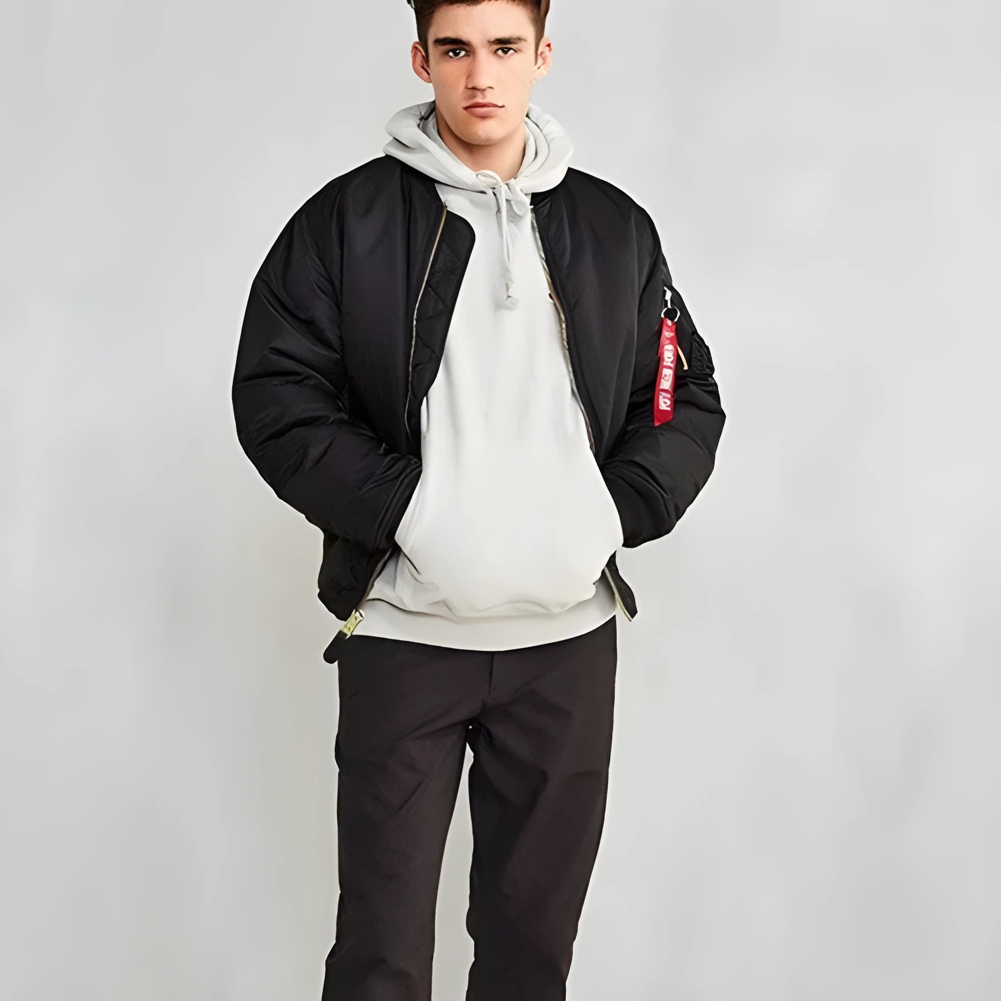 Men's army green loose fit nylon pilot jacket with cotton padding on a hanger.