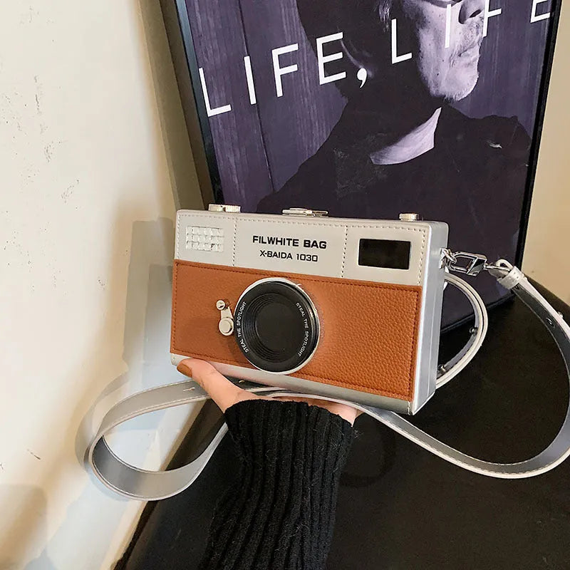 Mini horizontal square crossbody bag with chain strap in light brown PU synthetic leather.