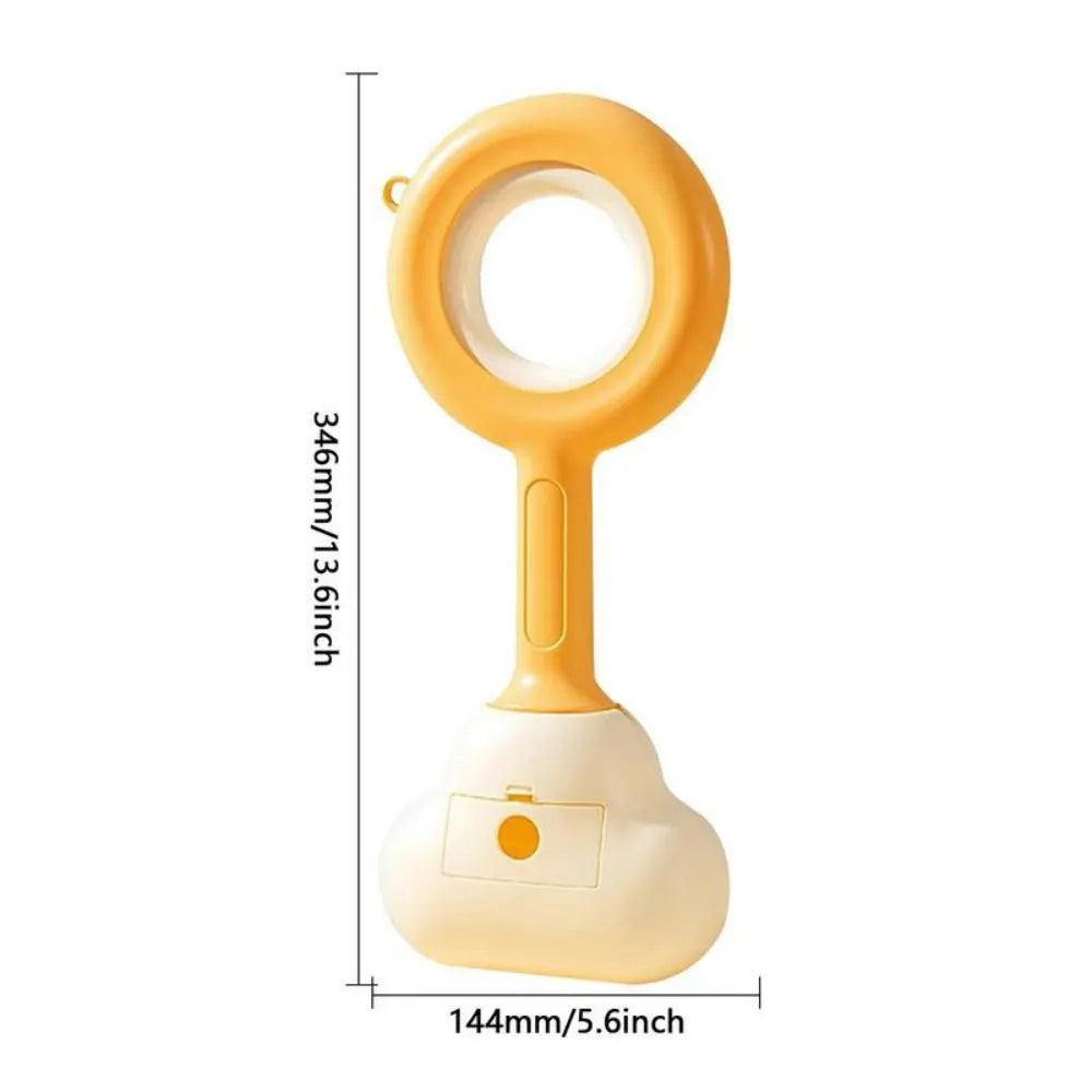 White blue dog pooper scooper with cloud-shaped jaw design on grass