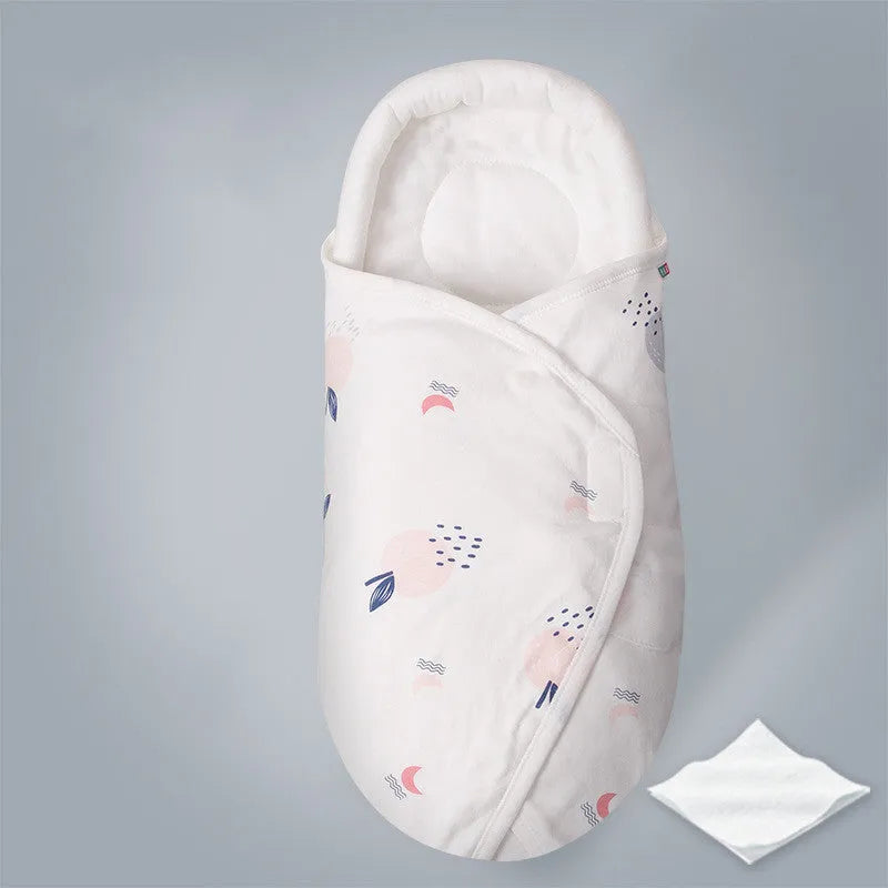 Cotton anti-startle swaddle blanket for babies in a colourful dinosaur print, 30 by 60 cm.