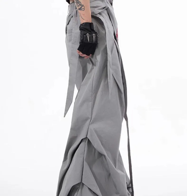 Boy modelling black wide-leg summer trousers with a relaxed fit and Korean-inspired style.
