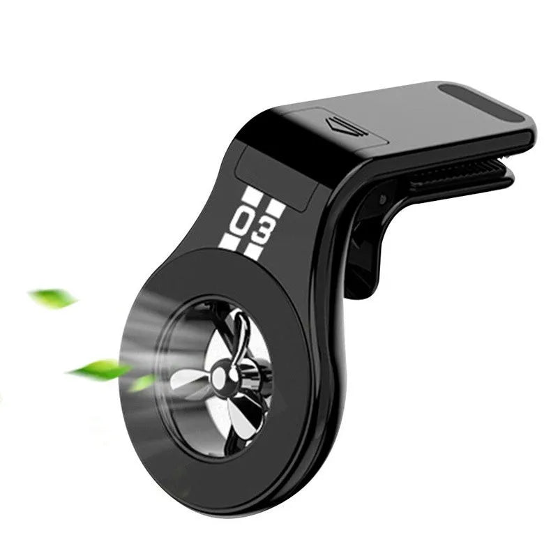 Magnetic car phone holder with fragrance diffuser clipped to car air vent