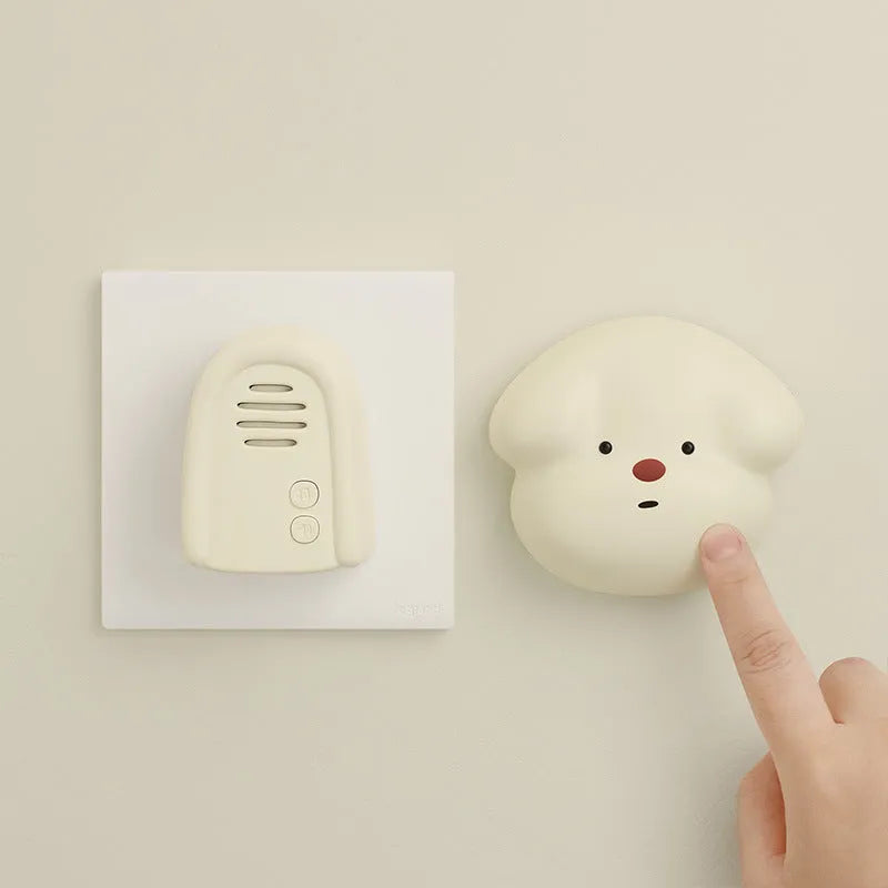 Wireless plug-in doorbell beeper for household use in white or milky yellow.