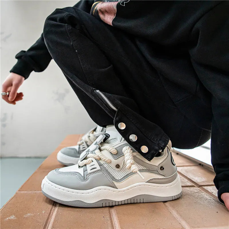 Men's artificial PU low-top lace-up casual sneakers in black with PVC sole and sewing line detail