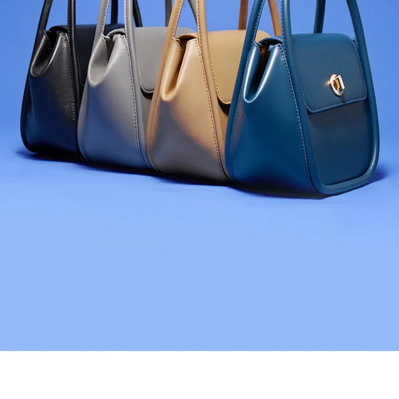 Genuine cow leather women's cross-body wing tote bag with latch closure and adjustable shoulder strap