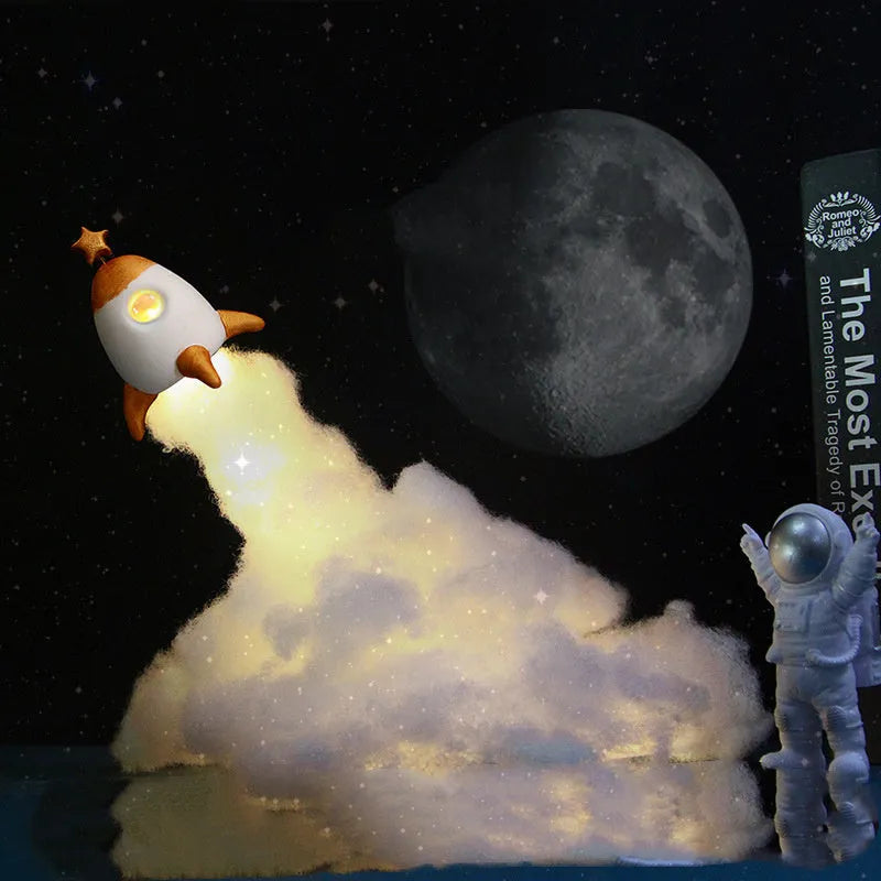 DIY LED Astronaut Rocket night light kit with string lights and assembly components on a desktop