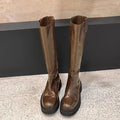 Black women's knee-high chunky heel boots with round toe and back zipper.