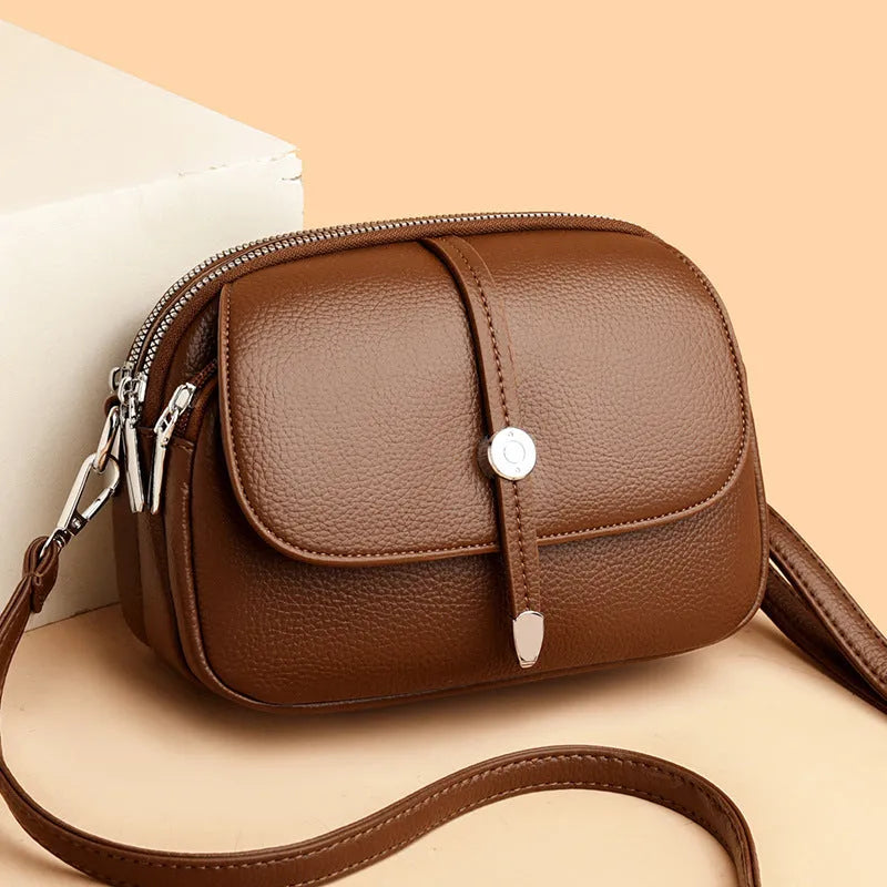 City Simple women's crossbody shoulder bag in soft PU leather with oval suitcase shape and sewing thread detailing