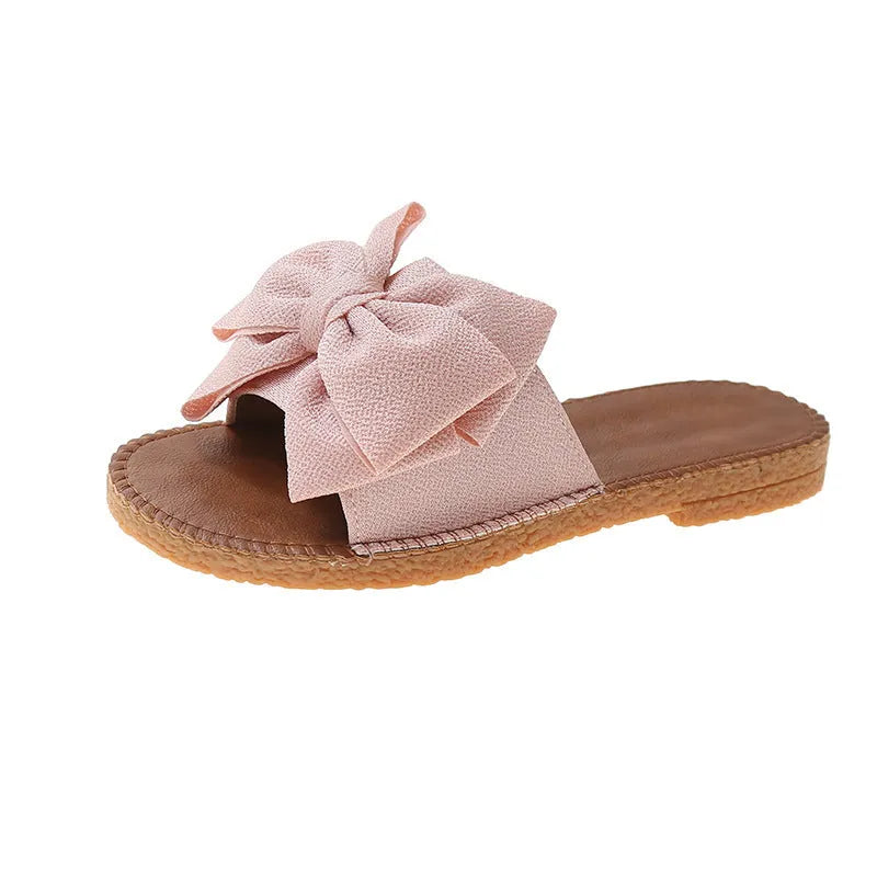 Women's slip-on cloth sandals with suede upper and decorative bow in beige colour