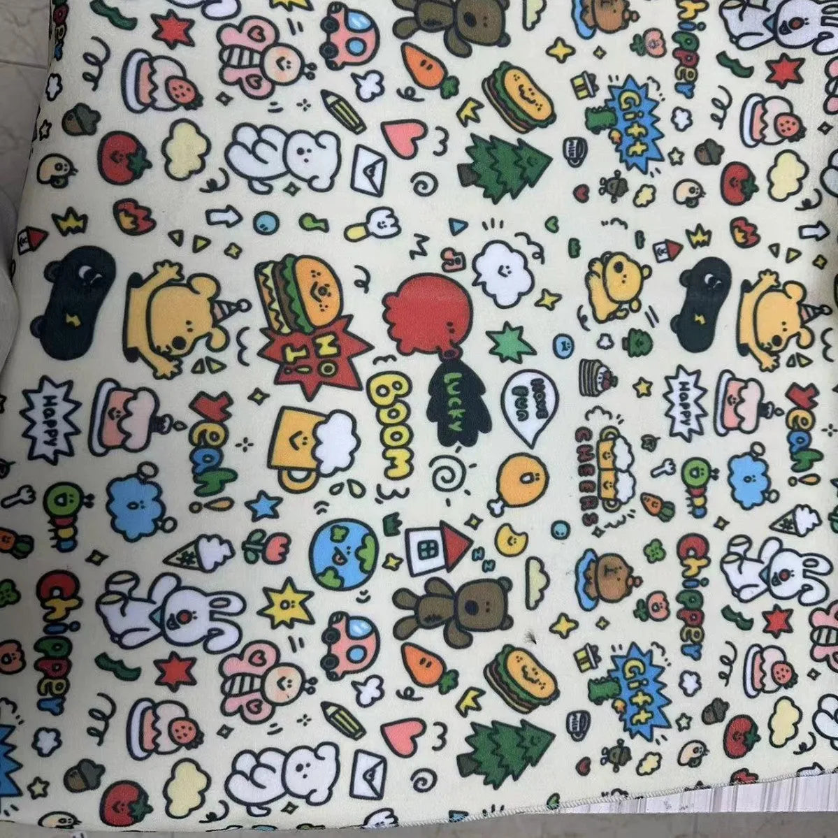 Blue Puppy printed nylon cosmetic bag showing zippered closure, shown next to medium and small size options.