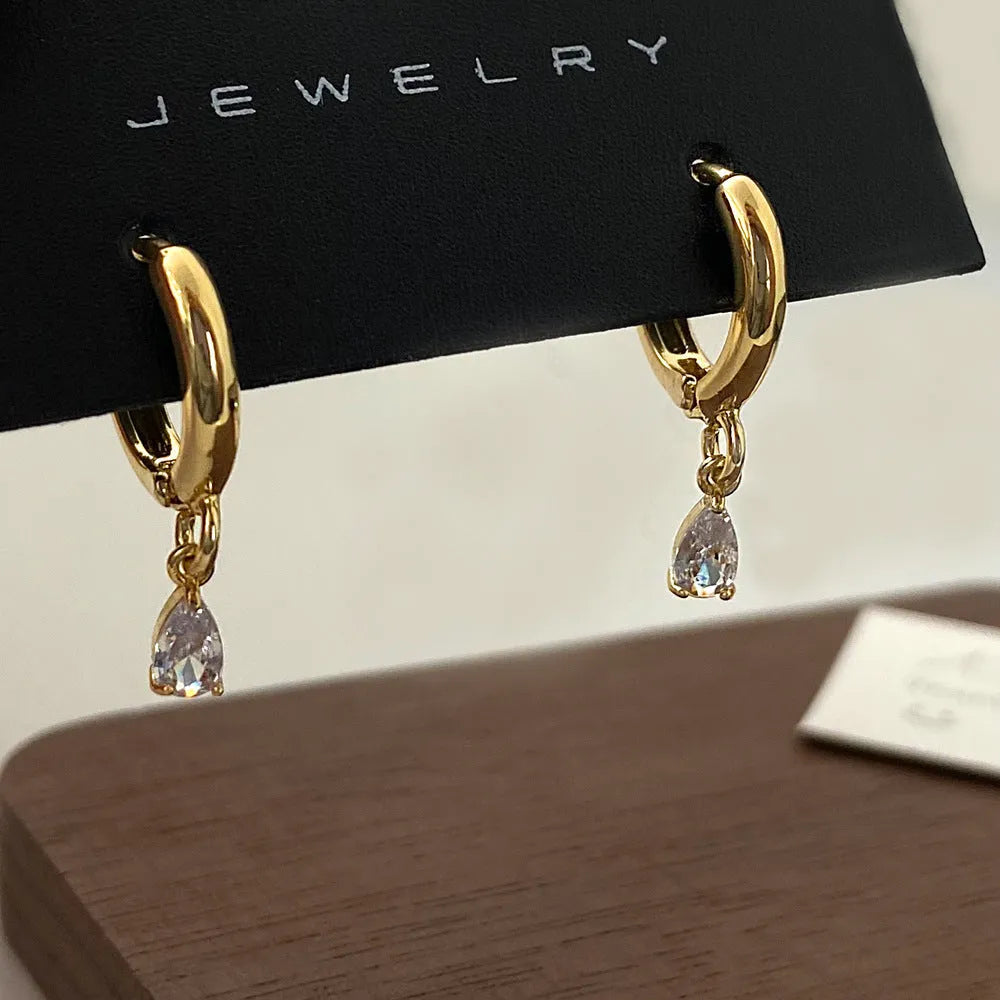 Three-piece zircon jewellery set for women showing necklace, earrings, and anklet with geometric meteor shower design.