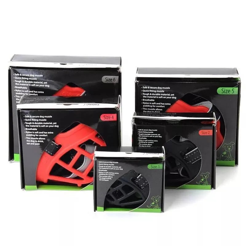 Soft silicone dog muzzle in black with cotton webbing strap on a table, anti-bite and anti-eating design