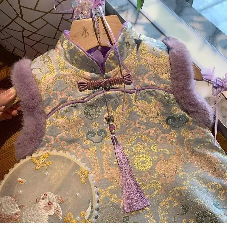 Girls' velvet padded cheongsam dress with floral pattern in purple colour on display